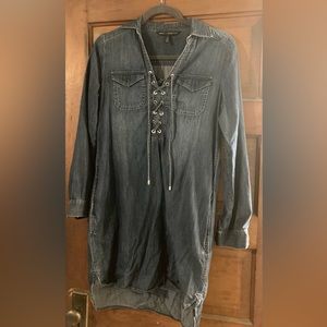 Denim dress with pockets and silver embellishment.